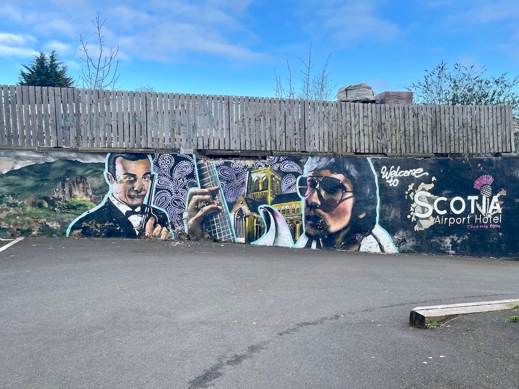 Paisley mural No. 26: "James Bond and friends" on New Inchinan Road at Hotel, Paisley town centre