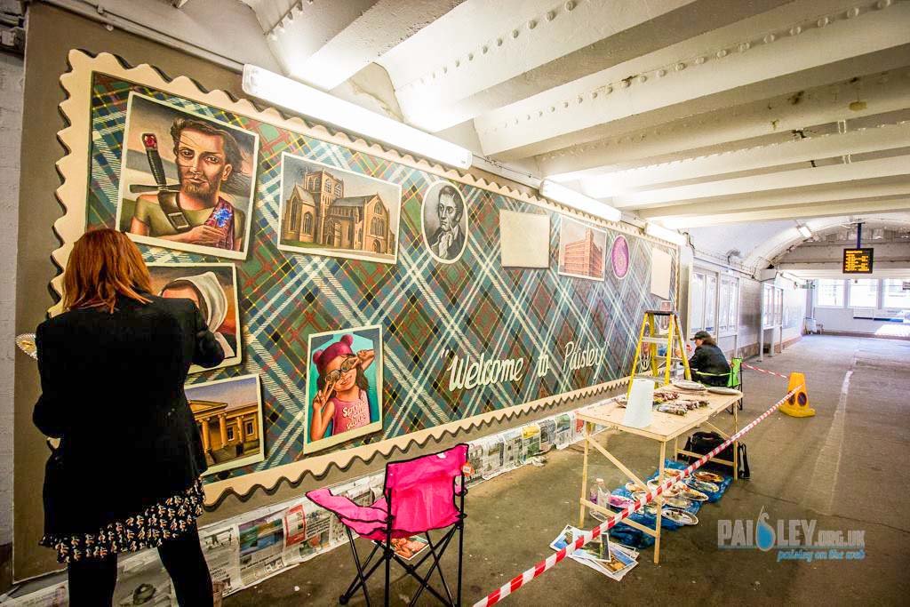 Paisley mural No. 25: "Welcome to Paisley" by Caroline Gormley & Sandy Guy (2017) on Gilmour Street Station, Paisley town centre